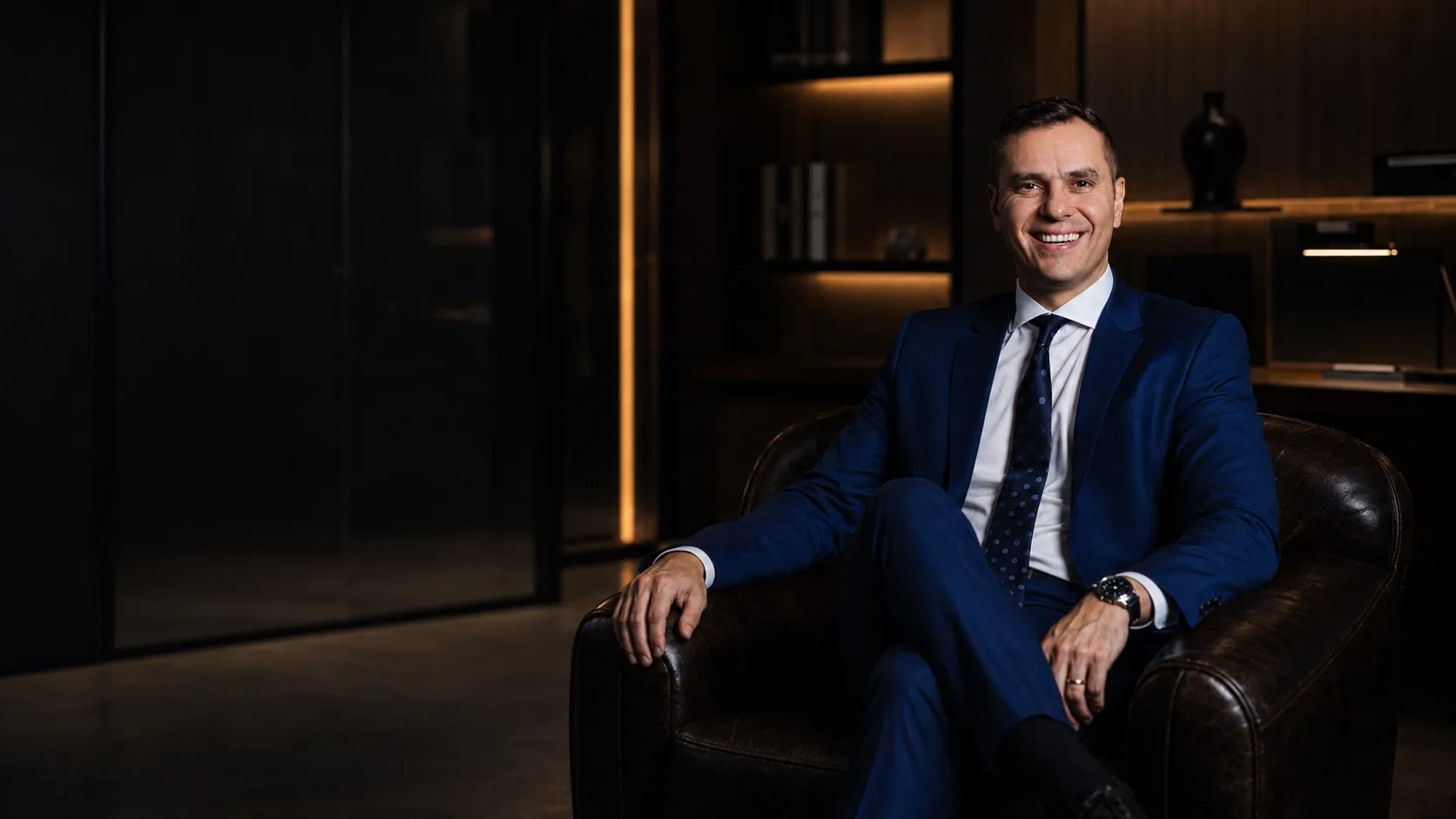 Attorney Felipe Alexandre sitting in an armchair in the office
